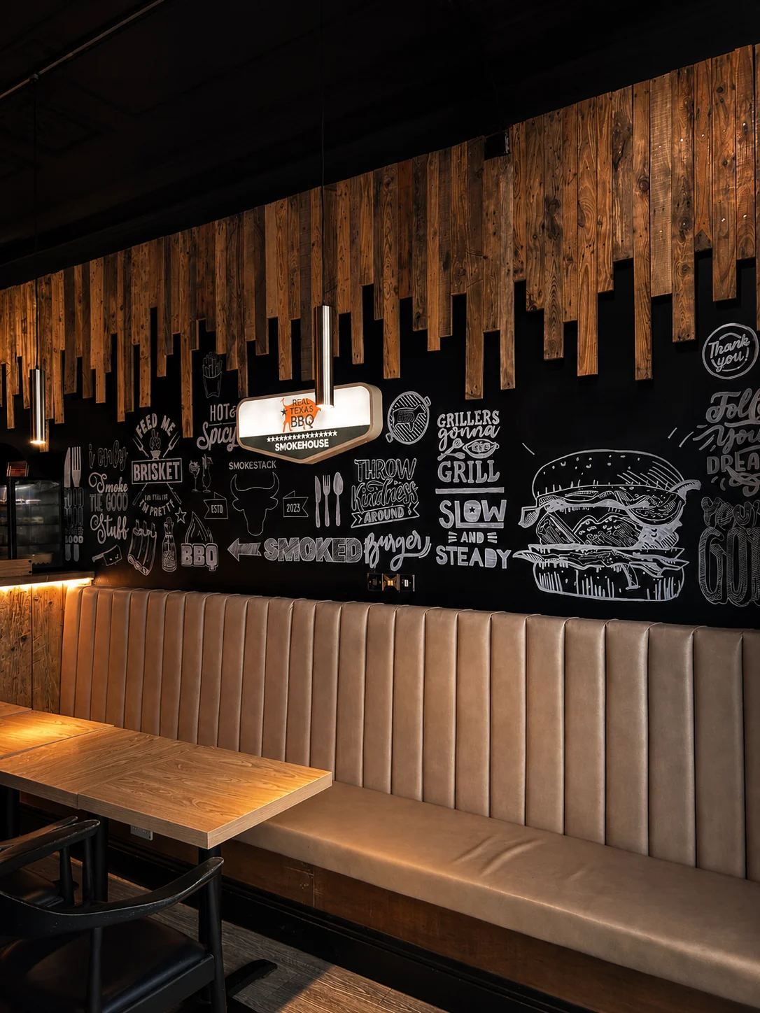 Smokestack booths and chalk wall